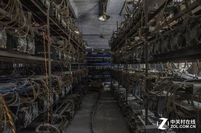 Inside a French mining farm with rows of active mining rigs